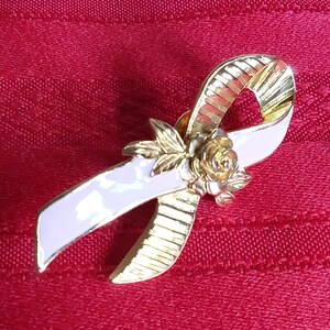 Avon pink cancer ribbon pin gold tone with pink and flower Vintage
