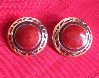 Round disk Vintage gold tone clip on earrings with purple and red center