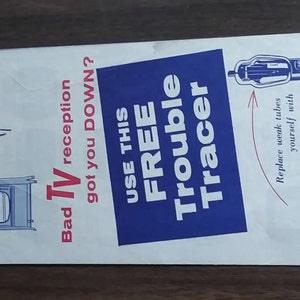 May include: A blue and white pamphlet with the text "Bad TV reception got you DOWN? USE THIS FREE Trouble Tracer" and an illustration of a television set with static. The pamphlet also features a picture of a vacuum tube and the text "Replace weak tubes yourself with RELIABLE SELECTRON TV-RADIO TUBES Guaranteed a full year".