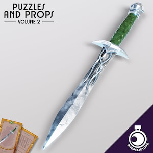May include: A silver and green elf dagger with a detailed design on the blade. The dagger has a green handle with a silver gem at the top. The dagger is a prop for role-playing games and fantasy settings.