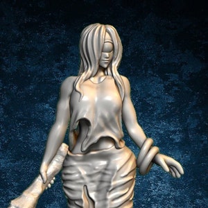 May include: A white 3D printed miniature of a female figure with long hair, wearing a long, flowing dress and holding a large club. The figure is standing on a plain background.