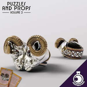 May include: A silver and gold ram head ring with intricate details. The ring features two ram heads facing each other with horns that are gold and the rest of the head is silver. The ring is a decorative piece and is part of a collection of puzzles and props.