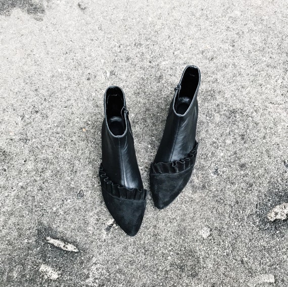 black leather pointed toe booties