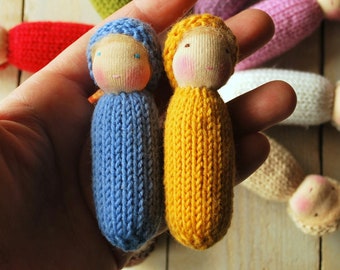 Two little knitted Waldorf dolls in Ukrainian colors