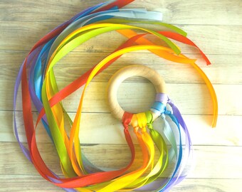 Waldorf speelgoed regenbooglint: beukenhouten zintuiglijke handvlieger