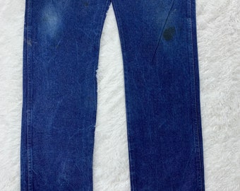 Vintage Wrangler faded blue jeans.. size 38..