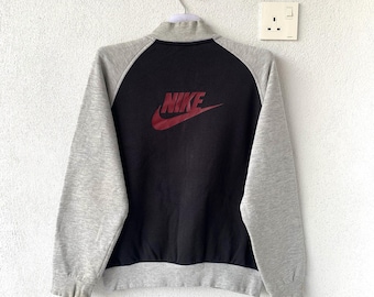 vintage NIKE varsity jacket spell out big logo.. swoosh logo. Vintage jacket.. size S