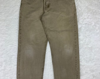 Vaqueros Wrangler vintage marrones descoloridos. Talla 36