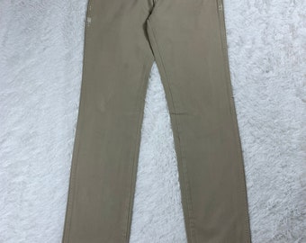 Vaqueros Wrangler vintage desgastados color caqui. Talla 29