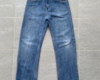 vintage LEVIS 514 blue faded jeans.. Vintage denim..