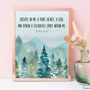 Puede incluir: Una impresión de acuarela con un paisaje de montaña y árboles en tonos azules y verdes. La impresión presenta el texto "CREATE IN ME A PURE HEART, O GOD, AND RENEW A STEADFAST SPIRIT WITHIN ME. Psalm 51:10".