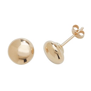 May include: A pair of gold ball stud earrings. The earrings are simple and elegant, and they would make a great gift for any occasion.
