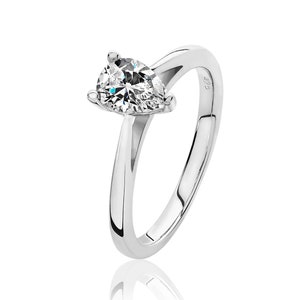 May include: A silver solitaire engagement ring featuring a pear-cut diamond. The ring has a polished band and a four-prong setting. The diamond is set on a white background.