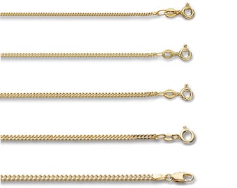 May include: A collection of gold-colored curb chain necklaces, each with a different thickness and clasp style. The chains are displayed against a white background, showcasing their varying designs and finishes. The clasps include lobster claw and spring ring styles.