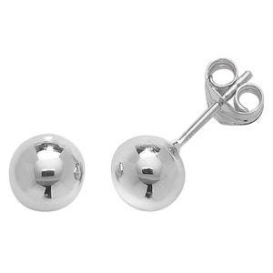 May include: A pair of silver ball stud earrings. The earrings are simple and classic, and they would make a great gift for any occasion.