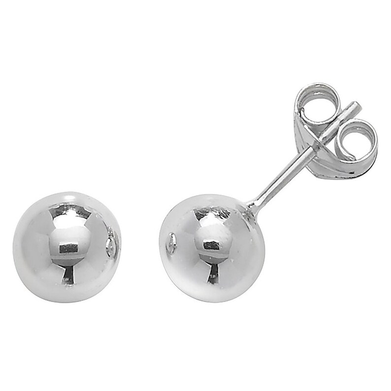 May include: A pair of silver ball stud earrings. The earrings are simple and classic, and they would make a great gift for any occasion.