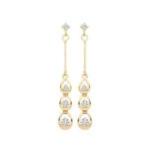 May include: A pair of gold drop earrings with three teardrop-shaped pendants, each featuring a clear round stone.