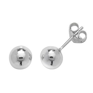May include: A pair of silver ball stud earrings. The earrings are simple and classic, and they would make a great gift for any occasion.