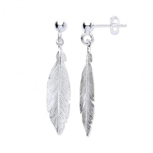 May include: A pair of silver feather earrings with a textured design. The earrings are dangle style with a small ball at the top.
