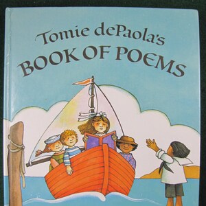 May include: A book titled "Tomie dePaola's Book of Poems" with an illustration of children on a red boat sailing on a blue sea. The children are reading a book, wearing sailor hats, and waving to a person on the shore.
