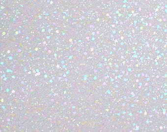May include: A close-up of a white surface with a speckled pattern. The specks are iridescent, reflecting colours like blue, green, and pink. The overall effect is a shimmering, textured background.