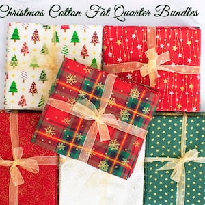 May include: Six bundles of Christmas fabric fat quarters, each tied with a gold ribbon. The fabrics feature various Christmas patterns, including plaid, snowflakes, stars, and Christmas trees.