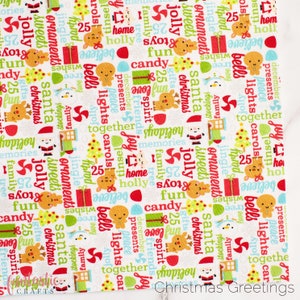 May include: White fabric with a repeating pattern of Christmas-themed words and illustrations. The words include "jolly", "presents", "santa", "christmas", "bells", "lights", "carols", "joy", "family", "tree", "home", "believe", "25", "fun", "candy", "spirit", "friends", "memories", "stockings", "love", "jingle", "ornaments", "sweets", "tinsel", "peace", "together", "gifts", "shop", "holiday". The illustrations include a reindeer, a snowman, a gingerbread man, a Christmas tree, a gift box, and a candy cane.