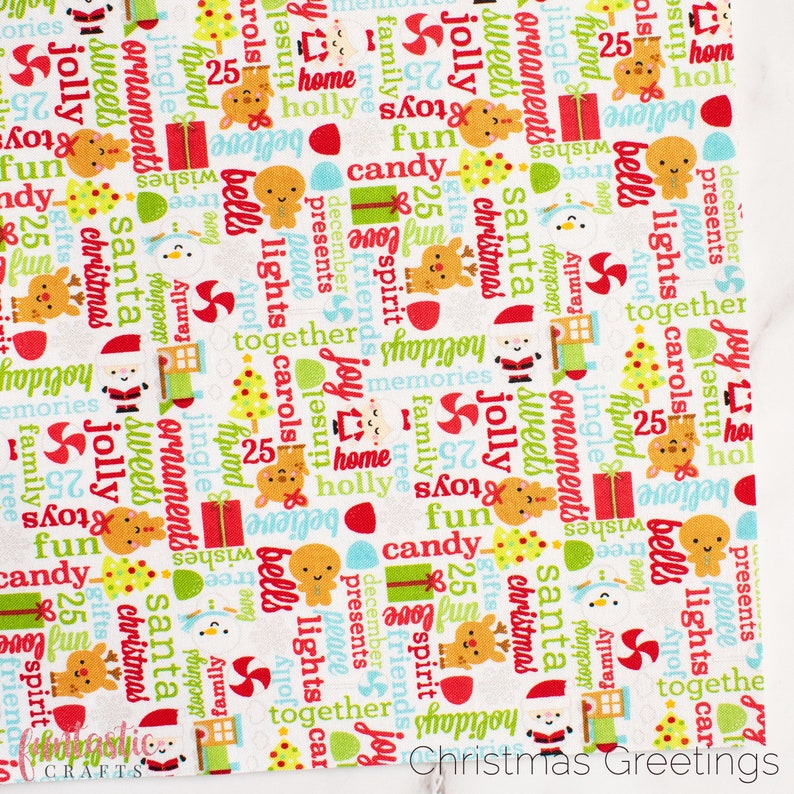 May include: White fabric with a repeating pattern of Christmas-themed words and illustrations. The words include "jolly", "presents", "santa", "christmas", "bells", "lights", "carols", "joy", "family", "tree", "home", "believe", "25", "fun", "candy", "spirit", "friends", "memories", "stockings", "love", "jingle", "ornaments", "sweets", "tinsel", "peace", "together", "gifts", "shop", "holiday". The illustrations include a reindeer, a snowman, a gingerbread man, a Christmas tree, a gift box, and a candy cane.
