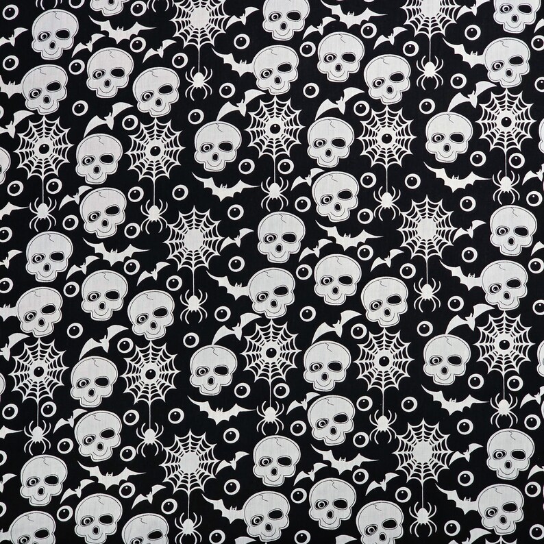 May include: Black and white fabric with a repeating pattern of skulls, spiderwebs, bats, and eyeballs.