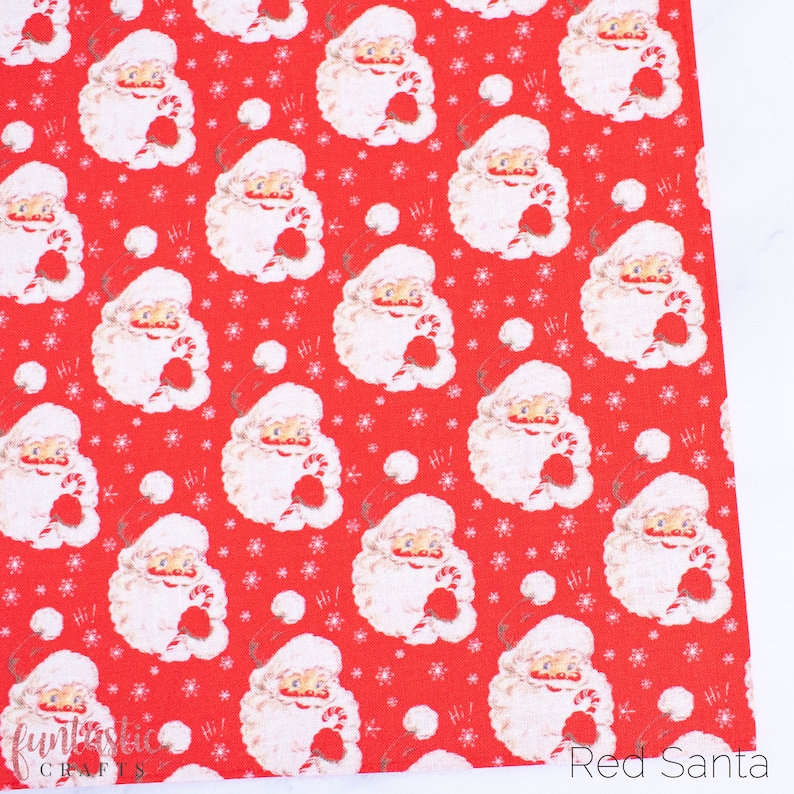 May include: Red fabric with a repeating pattern of a white Santa Claus holding a candy cane. The background is red with white snowflakes. The text "Hi!" appears throughout the fabric.