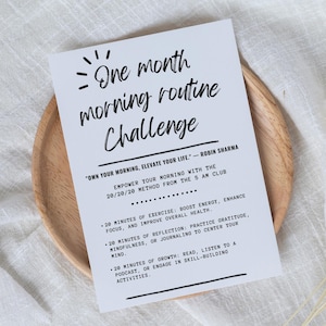 May include: A printable motivational poster with a white background and black text. The poster features a quote from Robin Sharma, "Own your morning, elevate your life." The poster outlines a 20/20/20 method for a one-month morning routine challenge.