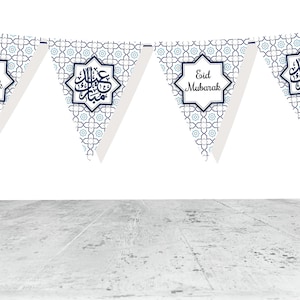 May include: A string of triangular Eid Mubarak banners. Each banner features a geometric pattern in shades of blue and white. Some banners have the text "Eid Mubarak" in a white frame, while others have Arabic calligraphy.