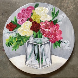 May include: A painting of a bouquet of flowers in a clear glass vase. The flowers are red, white, and pink. The background is a light gray.