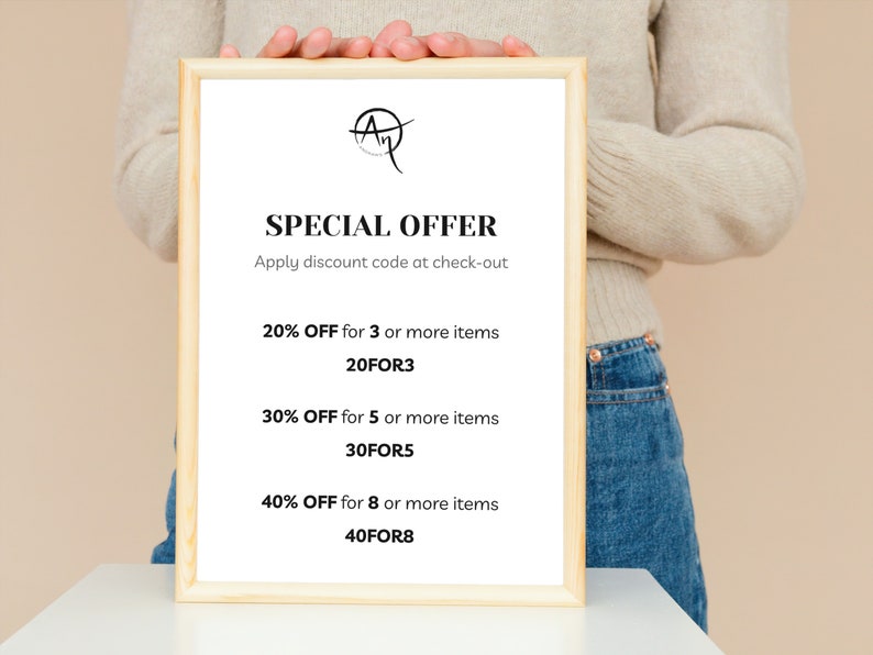 May include: A framed sign with the text "SPECIAL OFFER" and discount details. The sign is held by a person. The text includes "20% OFF for 3 or more items", "30% OFF for 5 or more items", and "40% OFF for 8 or more items".