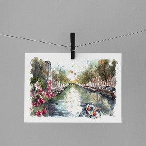 May include: Watercolor painting of a canal in a city with buildings on either side. The canal is lined with trees and there is a small boat in the water. The painting is done in a loose, impressionistic style.