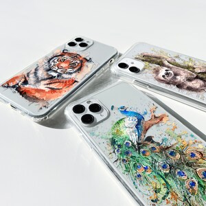 May include: Three clear phone cases with different animal designs. The first case features a tiger, the second case features a sloth, and the third case features a peacock.