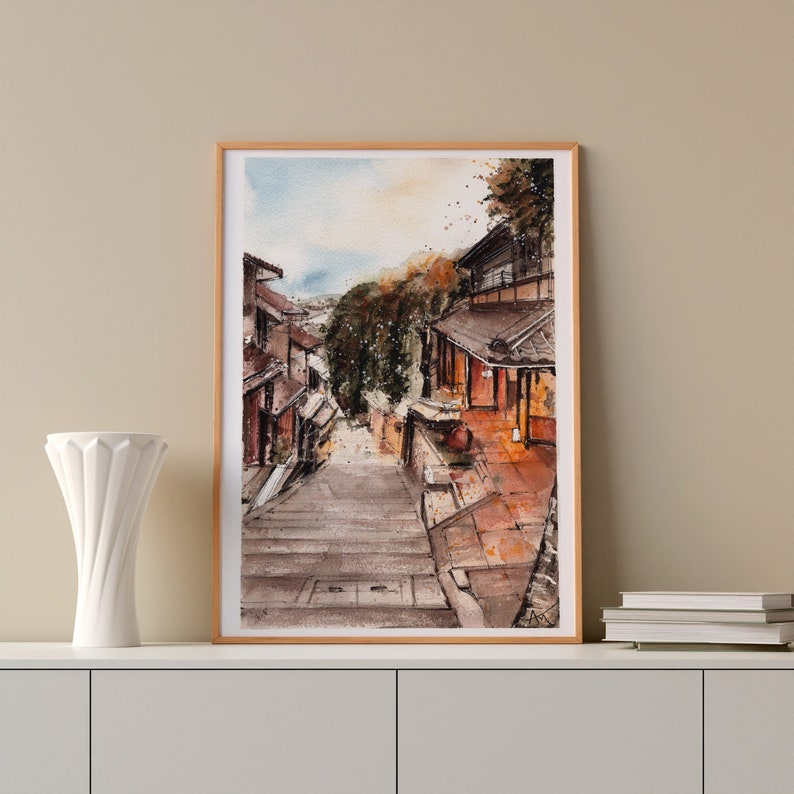 May include: A watercolor painting of a narrow street in a Japanese village. The street is lined with traditional houses and leads up a set of stone steps. The houses are painted in shades of brown and red, and the steps are covered in moss.