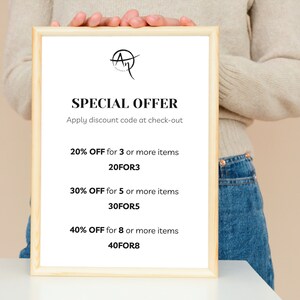 May include: A white framed sign with a special offer for buying multiple items. The sign reads "SPECIAL OFFER Apply discount code at check-out 20% OFF for 3 or more items 20FOR3 30% OFF for 5 or more items 30FOR5 40% OFF for 8 or more items 40FOR8"