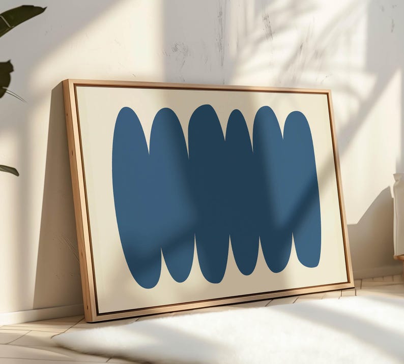 May include: Abstract art print with a cream background and five blue rounded shapes in a horizontal row.