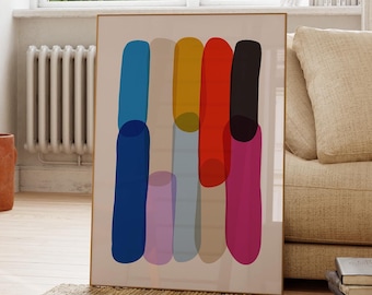 Puede incluir: Una impresión de arte mural rectangular enmarcada que presenta una serie de barras de color verticales, redondeadas y superpuestas en tonos azul, beige, amarillo, rojo, negro, rosa y gris sobre un fondo crema claro, en un marco metálico fino.