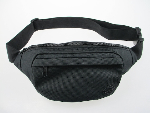 Black Fanny Pack - durable with a built-in wallet for cards and money.  Perfect waist pack for travel. This is not a cross-body bag.