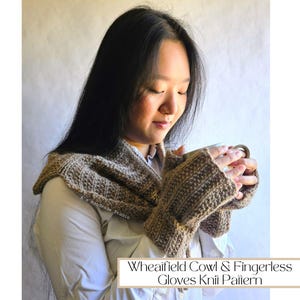 May include: A woman wearing a brown knitted cowl and fingerless gloves, holding a cup of coffee. The text "Wheaifield Cowl & Fingerless Gloves Knit Pattern" is visible at the bottom of the image.