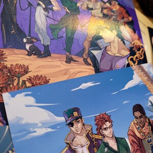 May include: A group of four anime characters, three men and one woman, are standing together. The men are wearing colorful outfits with a star design. The woman is wearing a green outfit. The background is a blue sky with white clouds.