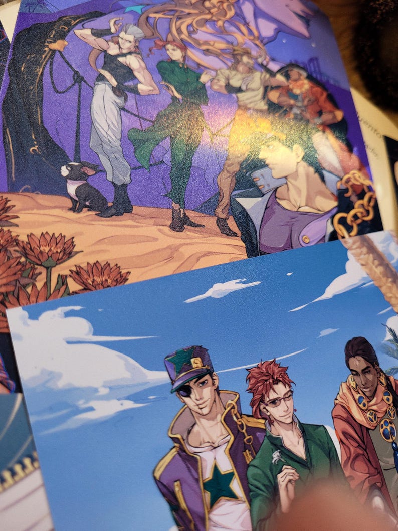 May include: A group of four anime characters, three men and one woman, are standing together. The men are wearing colorful outfits with a star design. The woman is wearing a green outfit. The background is a blue sky with white clouds.