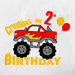 May include: A red monster truck with yellow flames on the side, two balloons, and the text "Crushin' my 2nd Birthday".