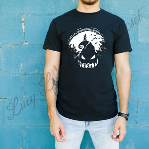 May include: Black t-shirt with a white graphic of a jack-o'-lantern with a silhouette of a couple standing on top of the pumpkin's head.