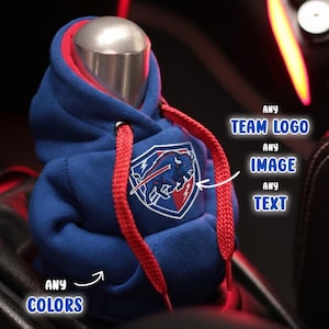 May include: A blue miniature hoodie with red drawstrings and a team logo patch. The image includes text that says "ANY TEAM LOGO, ANY IMAGE, ANY TEXT, ANY COLORS". The text at the bottom says "This print is just a sample."