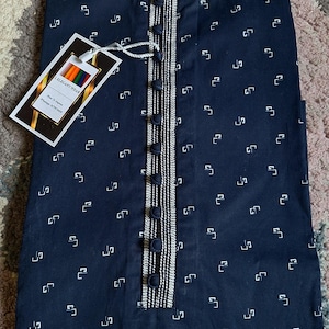 May include: Navy blue kurta with a white geometric pattern. The kurta features a mandarin collar, a button-down placket with decorative trim, and a tag that reads "I.ELEGANT WEAR".