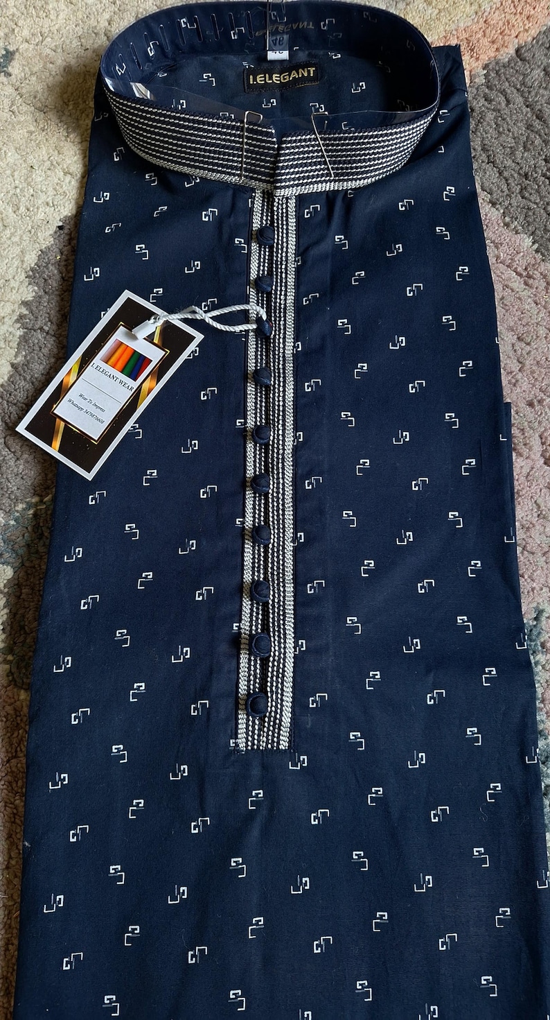 May include: Navy blue kurta with a white geometric pattern. The kurta features a mandarin collar, a button-down placket with decorative trim, and a tag that reads "I.ELEGANT WEAR".