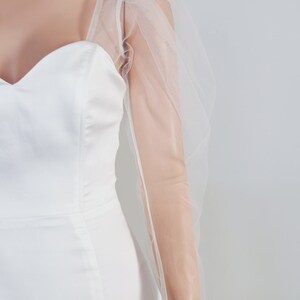 May include: White bridal separates with a sweetheart neckline and sheer tulle puff sleeves. The text "BRIDAL SEPARATES" is visible in the top right corner of the image.